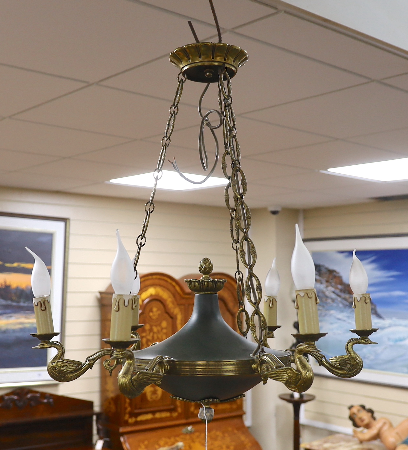 A French Empire style gilded bronze and tole ware six branch light, approximately 68cms high